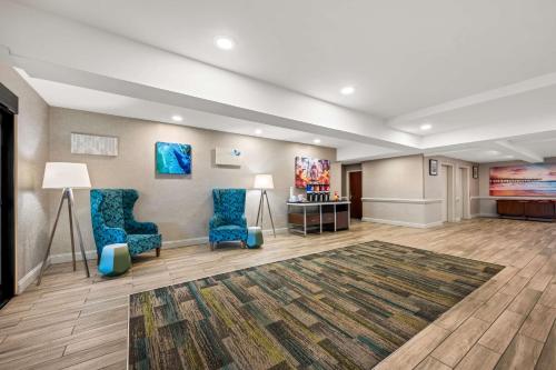 a waiting room with two chairs and a desk at Hampton Inn & Suites Wilson I-95 in Wilson