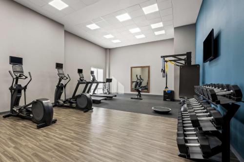 a gym with treadmills and exercise bikes in a room at Hampton Inn & Suites Wilson I-95 in Wilson