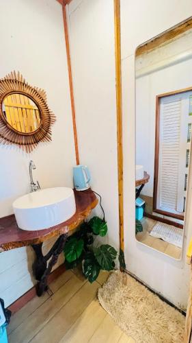 a bathroom with a sink and a mirror at Bnเกาะลิบงโฮมสเตย์ in Ko Muk