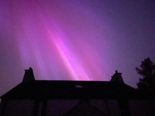 an image of the northern lights in the sky at Tullochard House B&B in Dunvegan