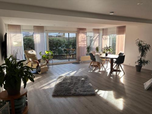 a large living room with a table and chairs at Business HO 03 in Neckarsulm