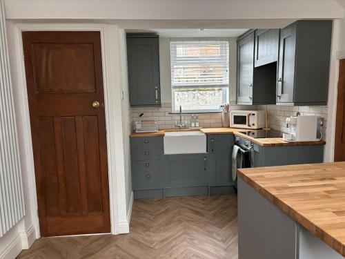 Köök või kööginurk majutusasutuses The Cottage - Cosy Filey Home