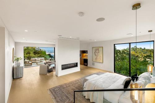 a white room with a bed and a living room at Woodhill Canyon in Los Angeles