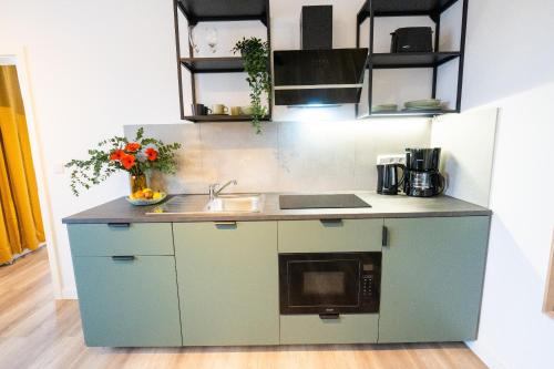 Η κουζίνα ή μικρή κουζίνα στο BetterBeds Recklinghausen - Herten