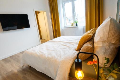 Ένα ή περισσότερα κρεβάτια σε δωμάτιο στο BetterBeds Recklinghausen - Herten