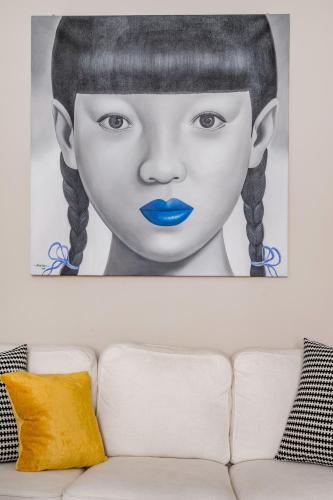 a drawing of a girl with blue lips at Casa Cenami in Lucca