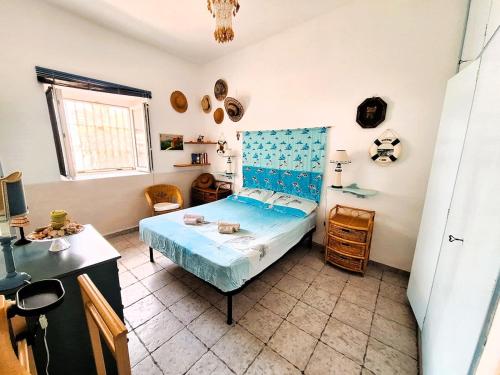 Ένα ή περισσότερα κρεβάτια σε δωμάτιο στο Villa il Timone