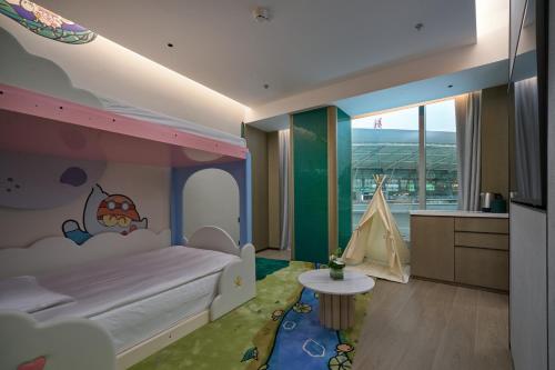 a bedroom with a bed and a tent in it at Holiday Inn Wuhan Tianhe Airport by IHG in Wuhan