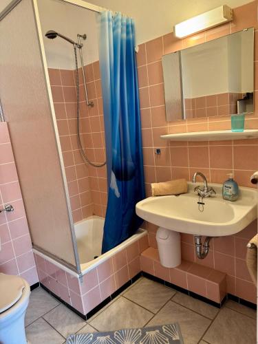 a bathroom with a sink and a shower at Poseidon 1 6 in Wangerooge