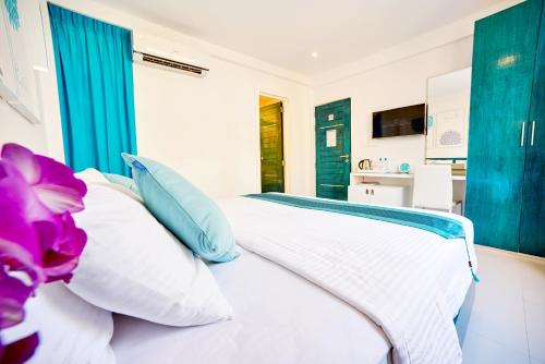 Postel nebo postele na pokoji v ubytování Planktons Beach