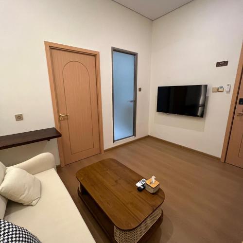 Μια τηλεόραση ή/και κέντρο ψυχαγωγίας στο Casabella Homestay 105 Batam Penuin