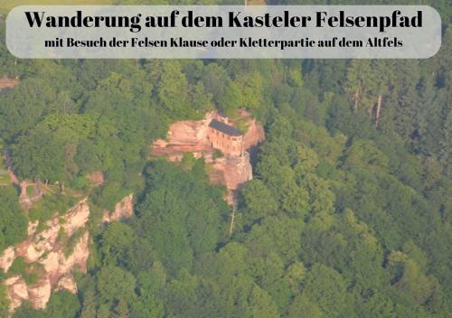 an image of a castle on top of a mountain at Ferienwohnungen Im Kimmelreich in Irsch