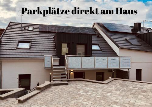 a house with a roof with the words patriarchy check an hawk at Ferienwohnungen Im Kimmelreich in Irsch