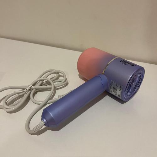 a hair dryer with a cord on a table at Casabella Homestay 207 Batam Penuin in Nagoya