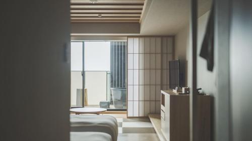 a hotel room with a bed and a large window at SOKI ATAMI - Vacation STAY 01424v in Atami