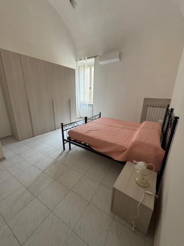 a bedroom with a bed and a table in it at Casa FLAVIA in Serracapriola
