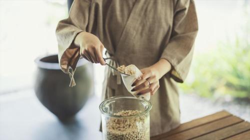 a person eating food from a bowl with a spoon at SOKI ATAMI - Vacation STAY 93416v in Atami