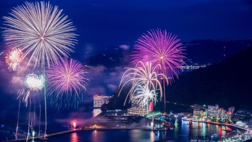 a firework display over a city at night at SOKI ATAMI - Vacation STAY 01436v in Atami