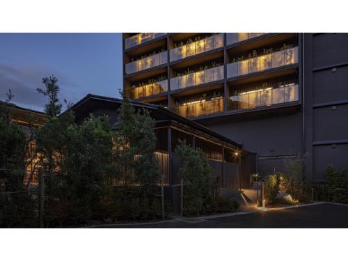 a large building with lights on in front of it at SOKI ATAMI - Vacation STAY 93416v in Atami