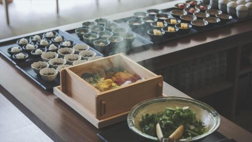 a box of food sitting on a table with cupcakes at SOKI ATAMI - Vacation STAY 01436v in Atami