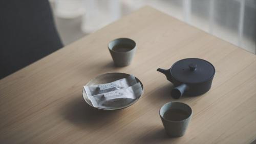 a table with three cups on top of a table at SOKI ATAMI - Vacation STAY 93416v in Atami