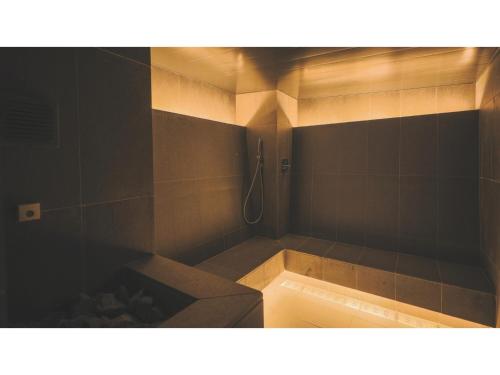 a bathroom with a bath tub with a shower at SOKI ATAMI - Vacation STAY 93405v in Atami