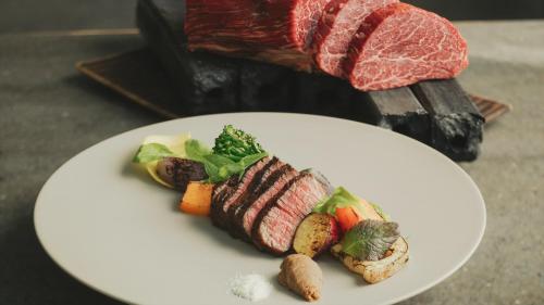 a plate of food with meat and vegetables on it at SOKI ATAMI - Vacation STAY 93429v in Atami