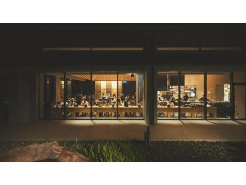 a group of people sitting at tables in a building at SOKI ATAMI - Vacation STAY 93411v in Atami
