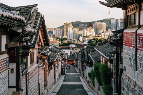 an alley in an asian city with buildings at Zen Seoul Stay in Seoul