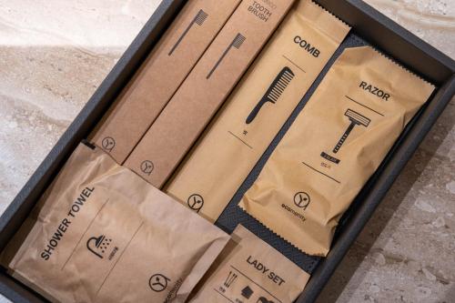 three brown paper bags sitting in a box at Hound Hotel Deacheon Beach in Boryeong