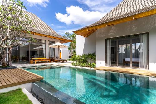 an image of a swimming pool in a villa at Anchan Flora by Villacarte in Ban Phru Champa