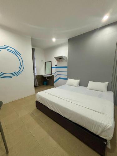 One Stop Hotel Ipohにあるベッド