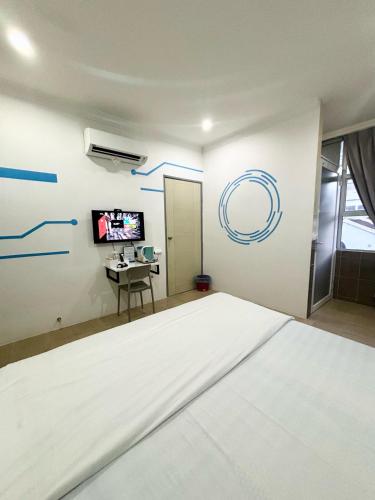 One Stop Hotel Ipohにあるベッド