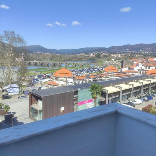a view of a parking lot from the roof of a building at Lima Zen Exclusive Apartment With View in Ponte de Lima