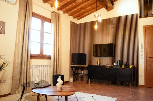 Televízia a/alebo spoločenská miestnosť v ubytovaní Agriturismo Casetta I