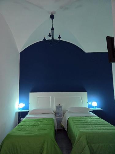 Ένα ή περισσότερα κρεβάτια σε δωμάτιο στο B&B SOGNANDO VIETRI e SPA ESCLUSIVA