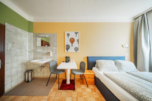 Postel nebo postele na pokoji v ubytování Vienna West Rooms