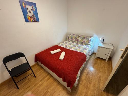 a small bedroom with a bed and a chair at L13 - 5 Bedrooms 2 Baths, Very Large Apartment by the Sea in Alicante