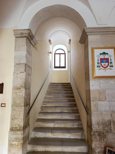 a staircase in a building with a window at Hostel il Tetto in Melfi