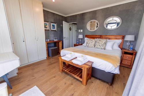 Ένα ή περισσότερα κρεβάτια σε δωμάτιο στο Sawubona Guesthouse
