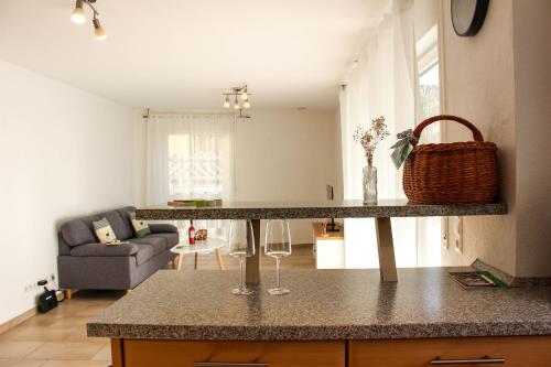 a kitchen with a counter with two wine glasses on it at Hotel & Restaurant Zum Reussenstein in Böblingen