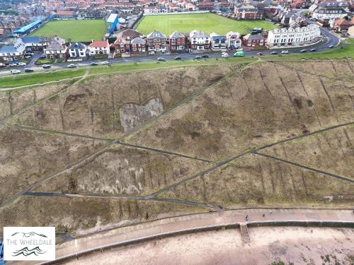 an aerial view of a road on the side of a hill at The Wheeldale in Whitby