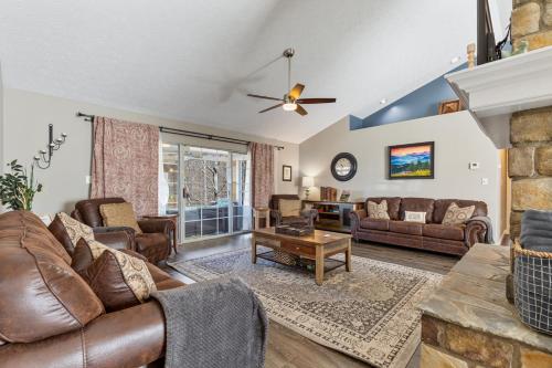 a living room with a couch and a fireplace at A Dolly Good Time in Sevierville