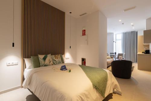 Una cama o camas en una habitación de Dorm4You Arena
