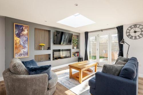 a living room with two couches and a table at Laurel Lodge - Stylish Two Bed & Free Parking in Box