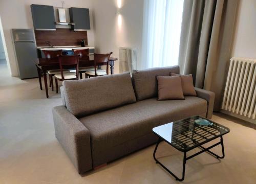 a living room with a couch and a table at Palazzo Fragasso in Rutigliano