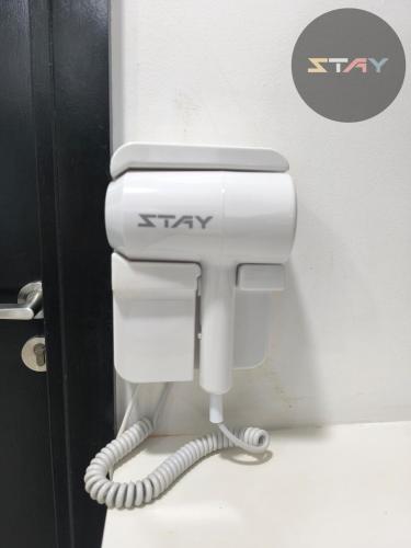 a white toilet in a bathroom with astay sign on it at Almas Couple Urban Retreat Puteri Harbour BySTAY in Iskandar Puteri