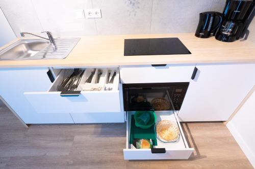 Kuchyň nebo kuchyňský kout v ubytování BetterBeds Gelsenkirchen