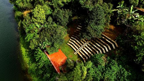 an aerial view of a house in the forest at Wayanad Silverwoods Forest Resort & Spa in Padinjarathara