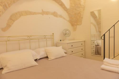 Ένα ή περισσότερα κρεβάτια σε δωμάτιο στο Casa Sorrentino Luxury Home